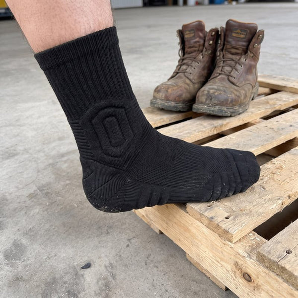 Chaussette TerraGuard à côté de chaussures de travail